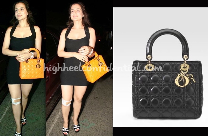 Ameesha Patel flashes her personalized Louis Vuitton bag at PVR Cinemas, in  Mumbai, on April 28, 2013.