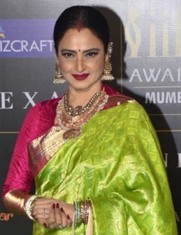 Bollywood actress Rekha leave for IIFA Awards at International Airport. .  Media